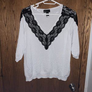 White sweater with black lace trim